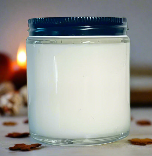 Glass jar with a blue lid on a wooden surface