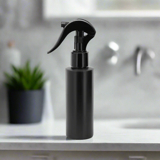 Black spray bottle on a white background
